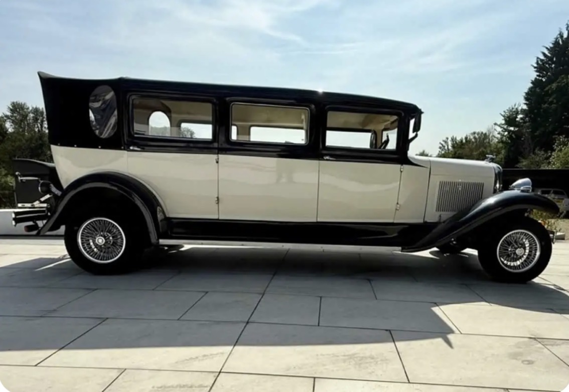 Side profile of the cream and black vintage Bramwith limousine